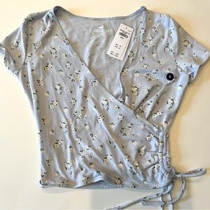 Hollister NWT baby tee, faux wrap. Baby blue. Size small.